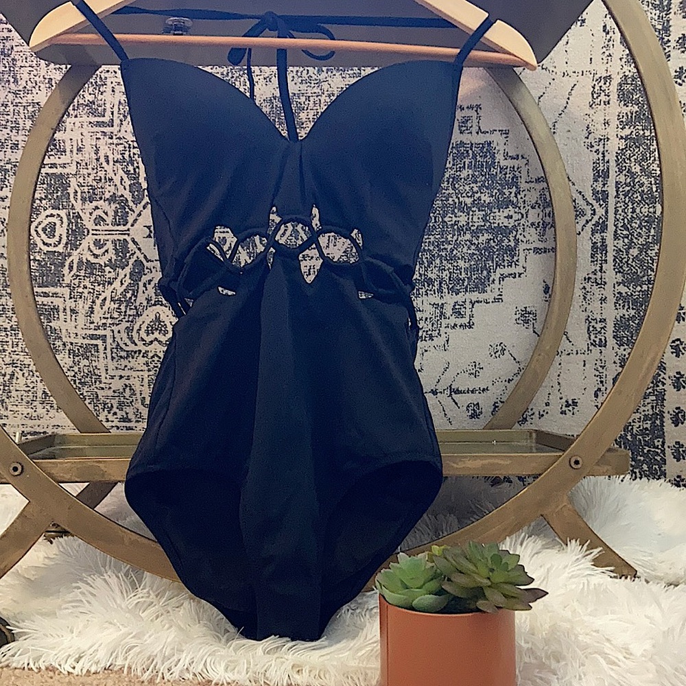 One piece black bathing suit. 34B cup